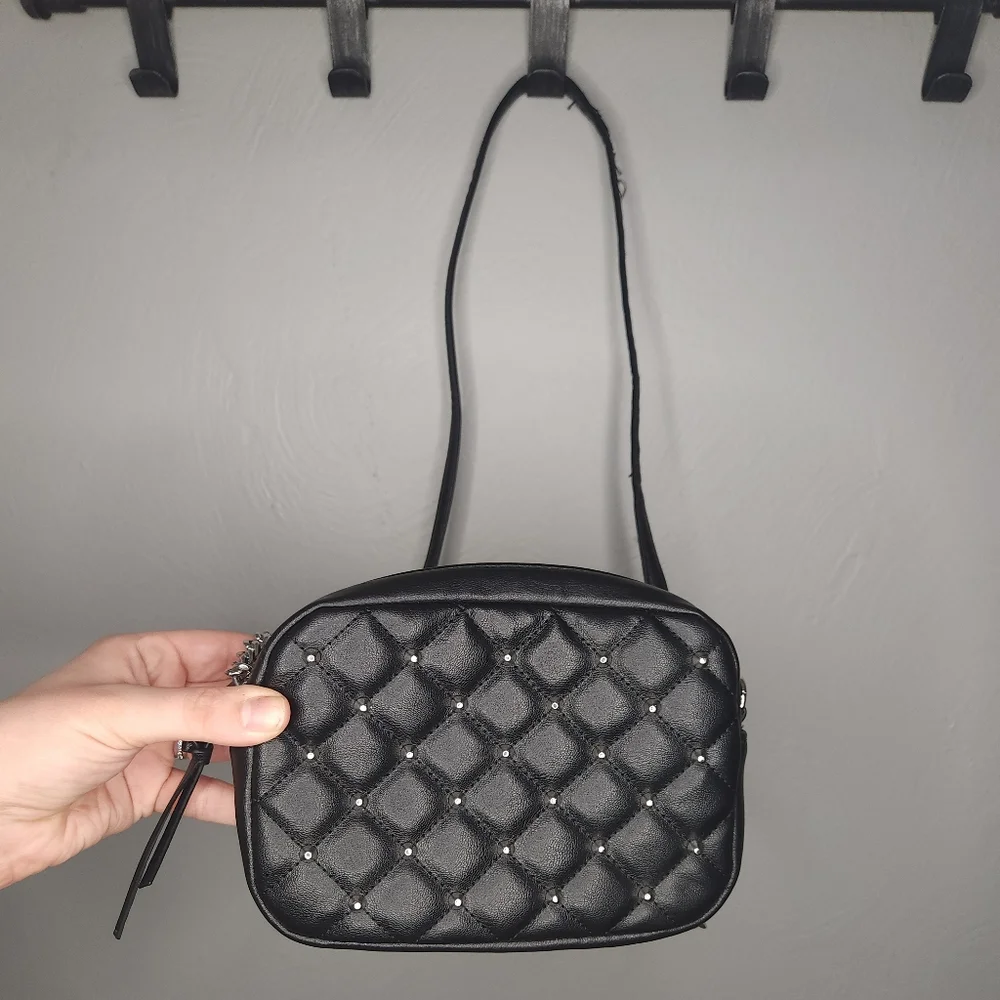 Rebecca Minkoff• Mini quilted studded black crossbody bag. 7.25” x 2.25” x 5.25”